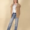 Veste beige structurée en tissu épais pour un look chic