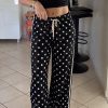 pantalon noir a pois blanc